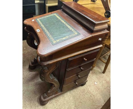 A 54cm modern Eastern hardwood Davenport with part fitted interior and flight of four short drawers to either side, set on ac