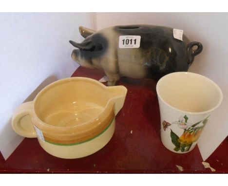 An Art Deco Clarice Cliff pottery gravy boat with hand painted banded decoration, a Portmeirion Pottery beaker decorated in t
