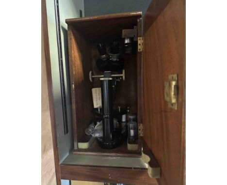 A vintage Prior of London binocular microscope with lenses and accessories in original wooden case