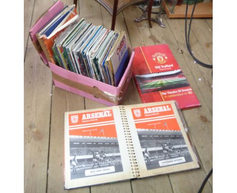 A box containing a quantity of sporting ephemera including football and rugby programmes, etc.