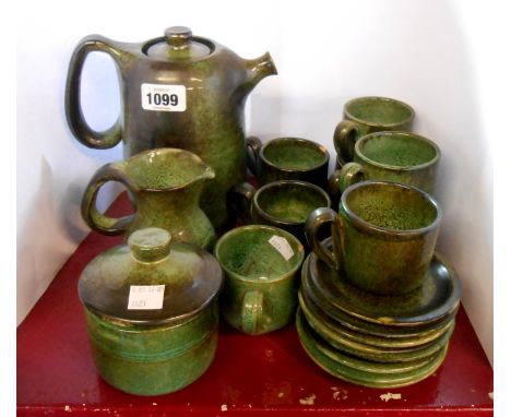 A 1950's French pottery coffee set with a mottled green souffle glaze finish comprising coffee pot, milk jug, sucrier and eig