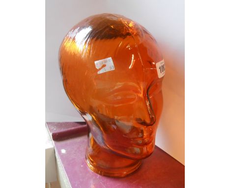 A vintage Cascade style orange glass mannequin head