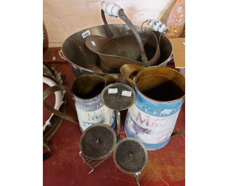 A quantity of metalware comprising two modern vintage style milk jugs with printed design, a brass coal scuttle of helmet for