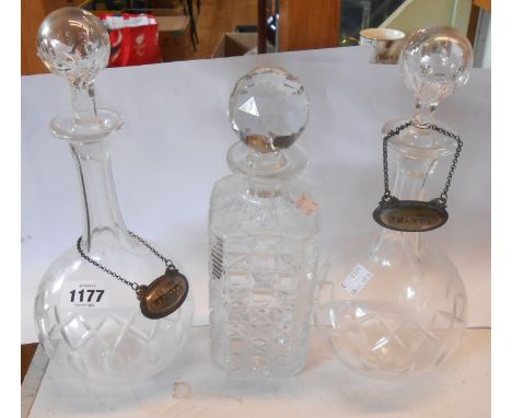 A pair of Edwardian decanters of globe form, each with a silver plated label for 'Brandy' and 'Irish Whiskey' - sold with a s