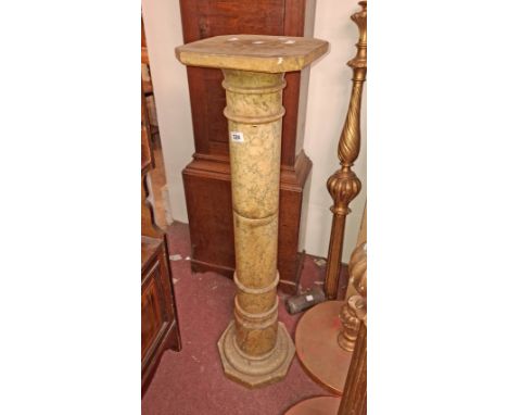 A 100cm green marble torchère, set on turned style pillar and octagonal base