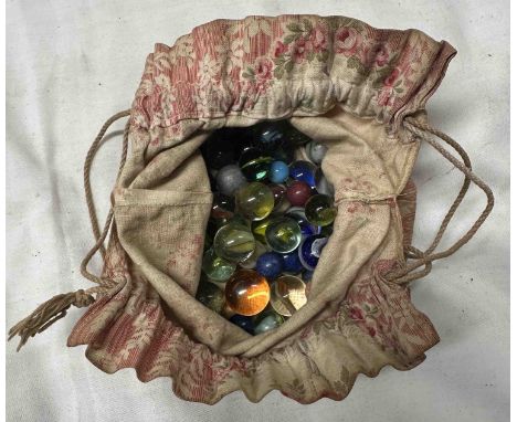 A bag containing vintage glass marbles