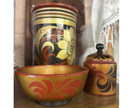 Three pieces of Russian folk art painted woodenware comprising two lidded pots and a bowl