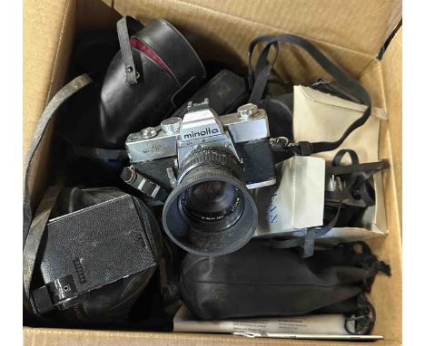 A box containing a quantity of vintage cameras and lenses for refurbishment including a Minolta SRT303 camera, an Ocean OX-2 
