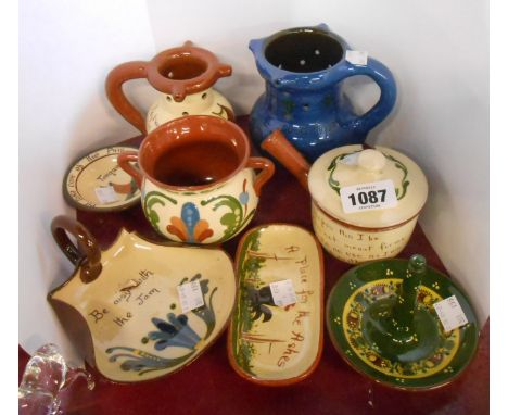 Eight pieces of Devon pottery including Brannam puzzle jug, Torquay puzzle jug, etc.