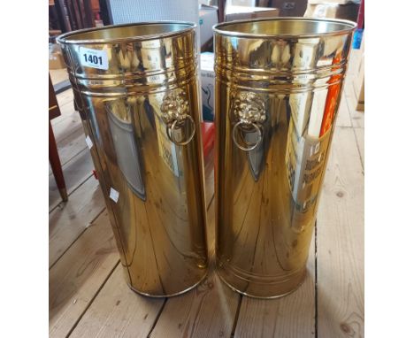 Two vintage brass umbrella stands with lion mask and ring handles