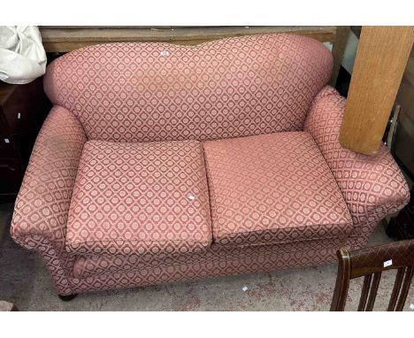 A 1.6m early 20th Century two seater drop-end settee with repeat pattern red and gold machine tapestry upholstery, set on bun