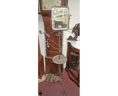 A late 19th/early 20th Century Arts &amp; Crafts Movement wrought iron and copper gentleman's shaving stand with oblong mirro