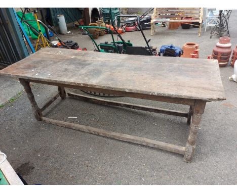 A 2.2m early 17th Century jointed oak refectory style table, set on simple bobbin turned supports and open stretcher base - o