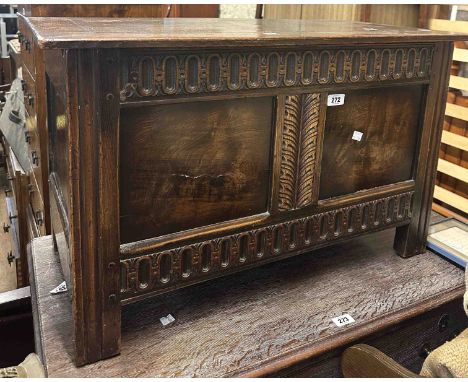 An 84cm oak coffer in the antique style with panelled front, set on block feet