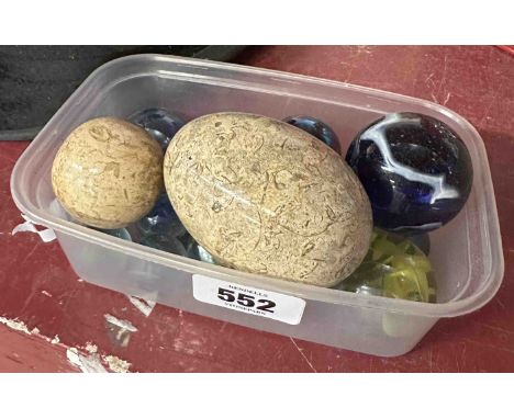 A small quantity of coloured glass marbles - sold with two polished stone eggs