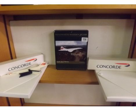 A SHELF WITH CONORD MEMORABILIA INCL; A WENTWORTH WOODEN JIGSAW OF CONCORD, TWO INVITATION PACKS &amp; TWO MODEL KITS
