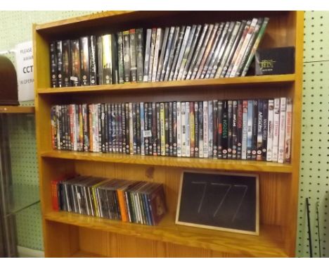 TWO SHELVES OF MIXED OF DVD'S &amp; A PART SHELF OF CD'S