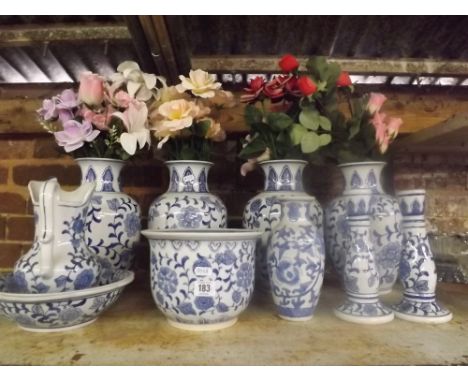 SHELF CONTAINING FOUR LARGE BLUE &amp; WHITE VASES WITH ARTIFICIAL FLOWERS, PLUS SIX OTHER PIECES OF BLUE &amp; WHITE 