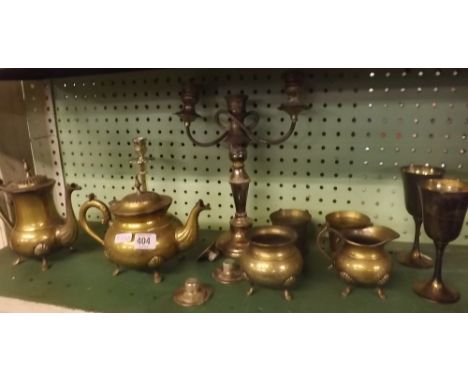 A SHELF OF PLATED &amp; BRASS WARE