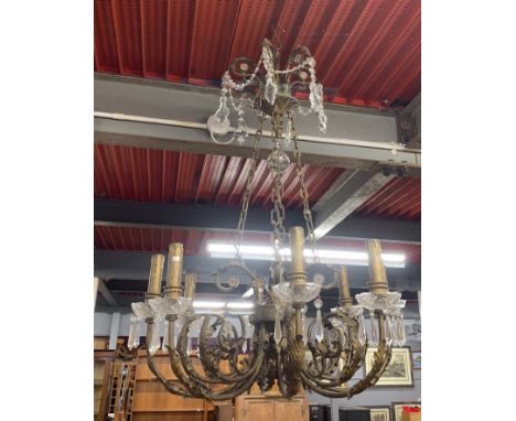 A large bronzed metal and crystal eight branch chandelier light fitting, H. 107cm, Dia. 67cm.