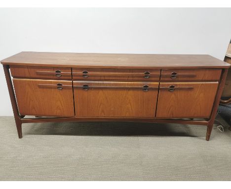 A 1960's light mahogany sideboard, some marks and stains to top, 182 x 45 x 73cm.