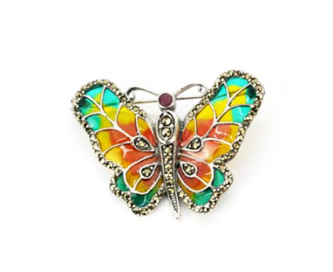 A 925 silver and enamel butterfly brooch set with faceted cut marcasite and a round cut ruby, L. 4.5cm.