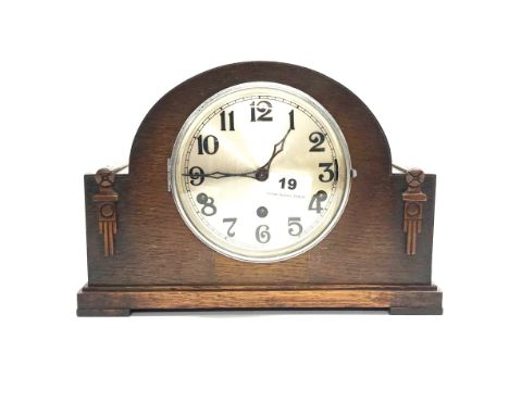 A 1930's chiming oak veneered mantel clock, H. 22cm.