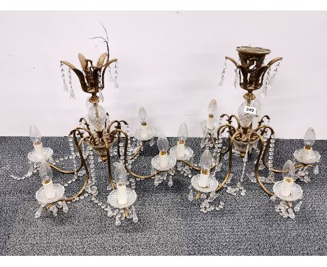 A pair of gilt brass and glass six branch chandelier light fittings.
