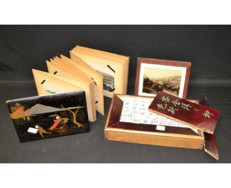 An early 20th century Japanese lacquered postcard album, with assorted contents, including Mount Fuji, Bermuda, Verona, Graha