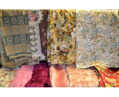 A large quantity of vintage textiles including printed linen curtains, a large embroidered tablecloth; vintage fabrics, etc