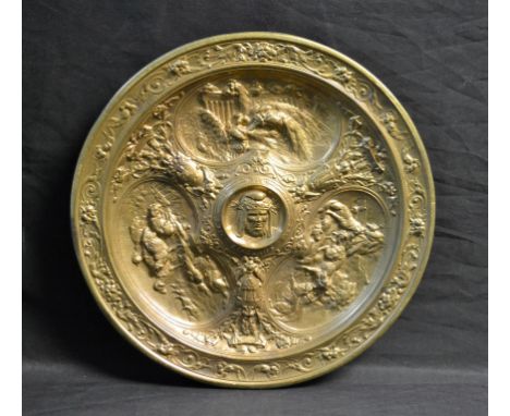 A 19th century French Revivalist gilt-patinated bronze circular dish, cast in high and low relief, centred by a portrait bust