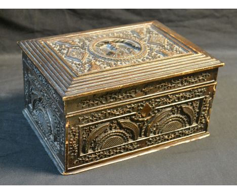 A 19th century Chinese hardwood rectangular table casket, the hinged cover carved in low relief with a central portrait round