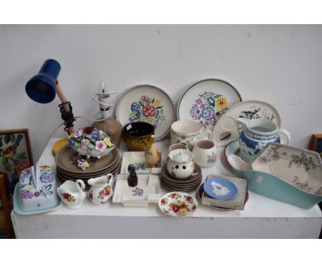 A collection of Twintone Poole Pottery wildlife stoneware items including plates and a bed side lamp together with other Pool