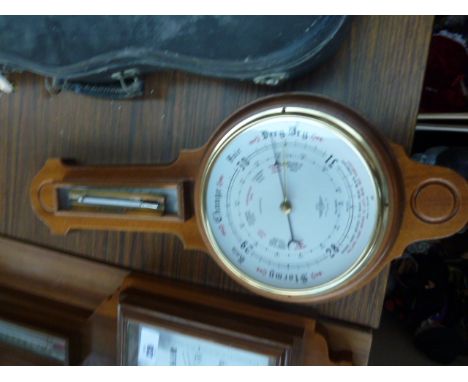 A carved oak banjo aneroid barometer and thermometer, circa 1930s made by SB Shortland and a vintage thermometer with a brass