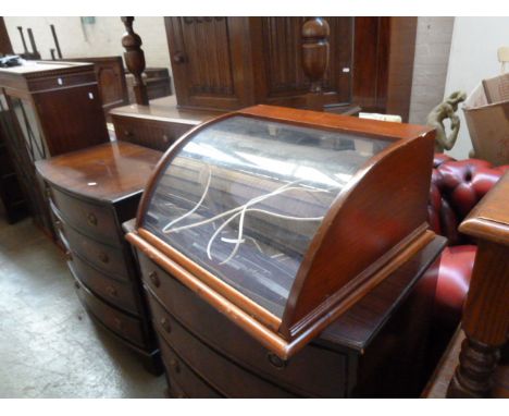 An early 20th century bow fronted glazed display cabinet with in light, 53cmW