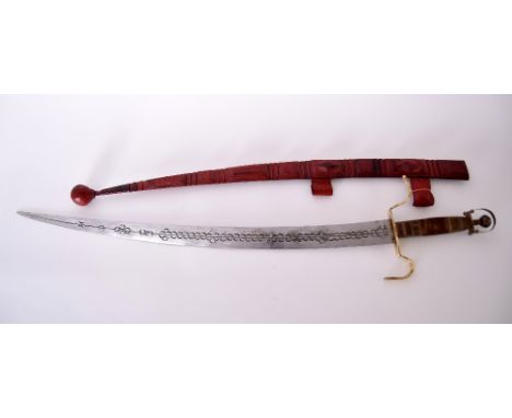 An early 20th century Tuareg/Berber curved sword and thick leather scabbard with traditional Saharah North African motifs, re