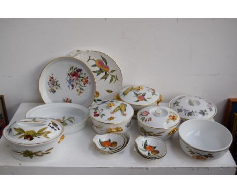 A large quantity of Royal Worcester 'Evesham' pottery including various serving dishes, tureens and covers, teapot, cake plat
