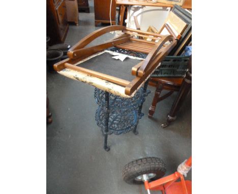 A blue painted cast iron pot stand with folding gout stool (2)