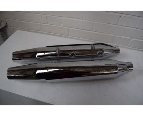 A pait of small Harley Davidson mufflers