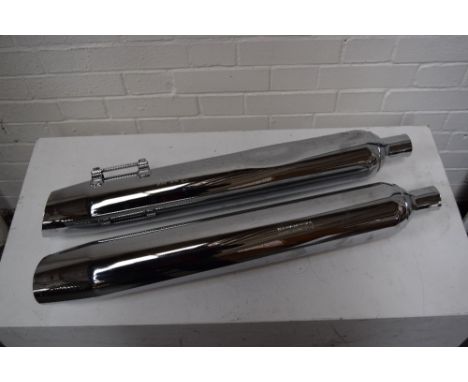 A large pair of Harley Davidson chrome mufflers