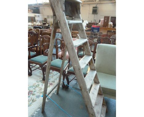 A vintage wooden folding step ladder, 160cm high