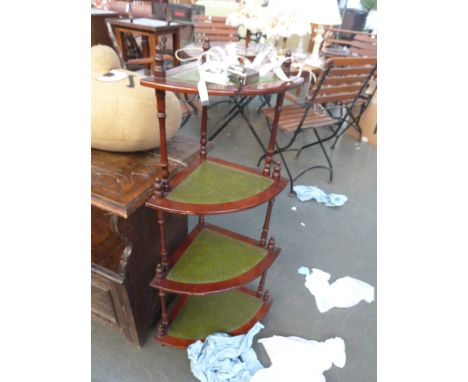 A 20th century mahogany and leather corner shelf/waht not, graduating, 102cmH