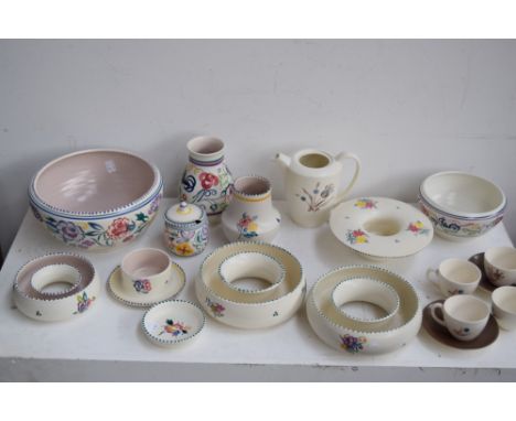 A large collection of twintone and hand painted floral design Poole Pottery including dishes, plates, vases, trinket dishes, 