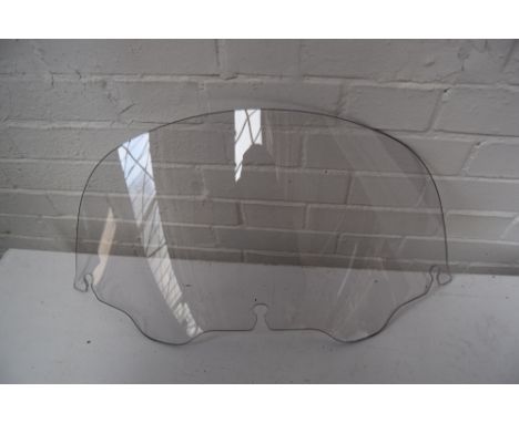 Two motorcycle screens, believed to be Harley Davidson. One unused, one well used.
