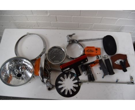 A box of assorted Harley Davidson lights and other parts.