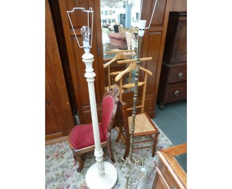 A brass standard lamp on three splayed feet, with a white painted standard lamp with fluted column and circular base, with a 