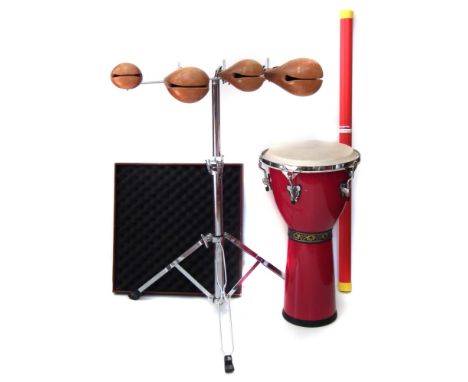 Collection of Percussion items, to include a Percussion Plus Rain Stick, Indian Djembe drum, and a set of woodblocks and stan