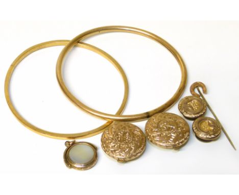 A group of rolled gold jewellery comprising two bangles, two pairs of buttons, a swivel fob and a horseshoe stick pin Conditi