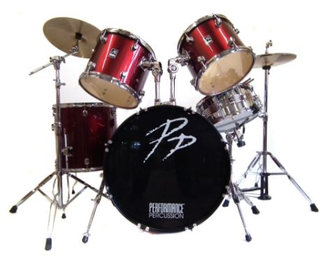 Performance percussion drum kit, finished in metallic red, including bass drum and pedal, stool, snare and stand, floor tom a