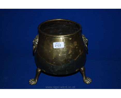 A Brass Planter with paw feet and lion's head handles, 9'' high
